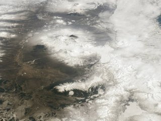 Как выглядят с МКС активизировавшиеся вулканы Камчатки